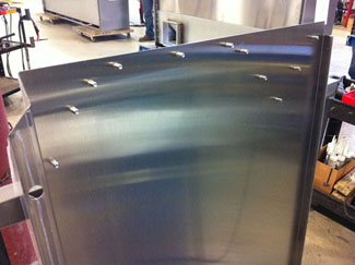 CaptiveAire stainless steel panel after stud welding process